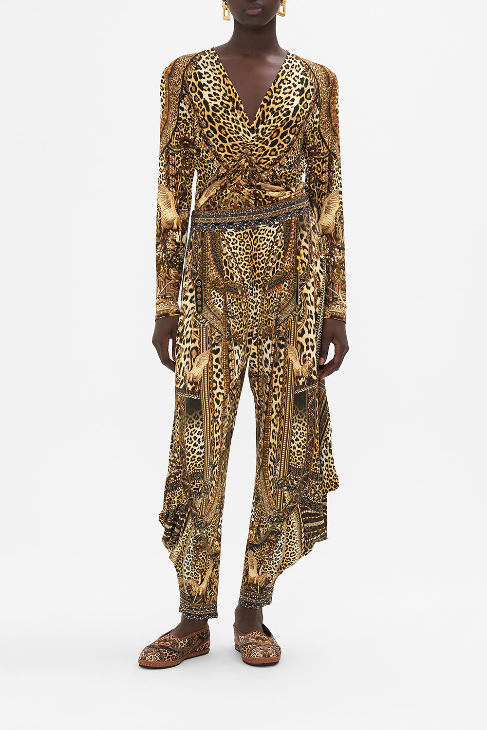 Front view of model wearing CAMILLA leopard print jersey long sleeve top in Standing Ovation print 