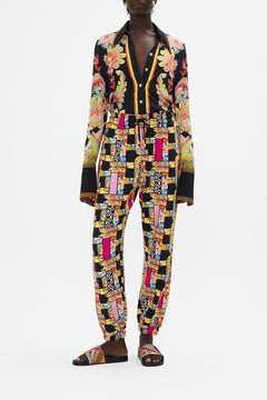 Front view of model wearing CAMILLA printed track pant in Signora Milano print 