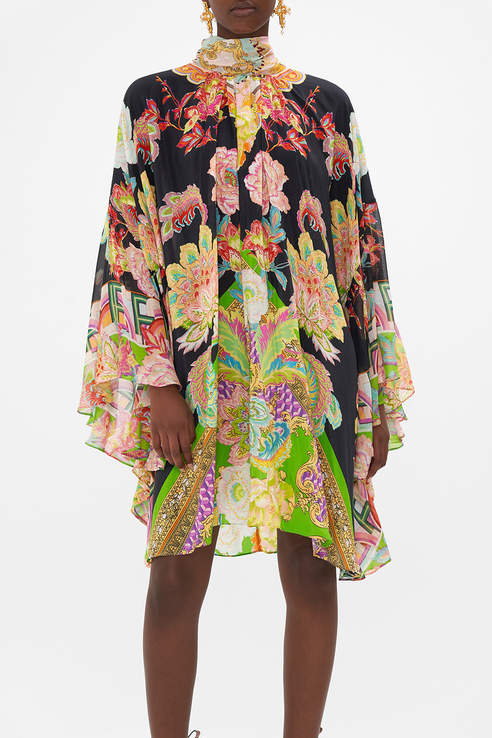 Crop view of model wearing CAMILLA silk high neck ruffle dress in Sundowners in Sicily print 