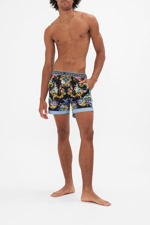 Front view of model wearing Hotel Franks By CAMILLA floral men swim shorts in Meet Me In Marchesa print