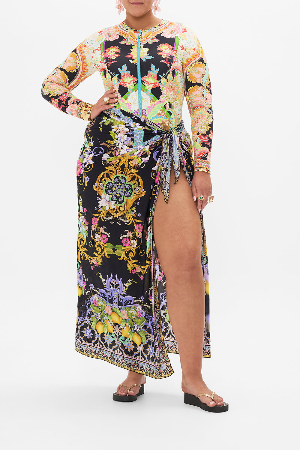 Front view of curvy model wearing CAMILLA plus size paddle suit in Sundowners in Siciliy print