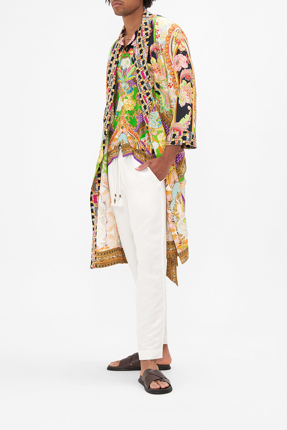 Side view of model wearing HOTEL FRANKS BY CAMILLA mens silk robe in Sundowners in Sicily print 