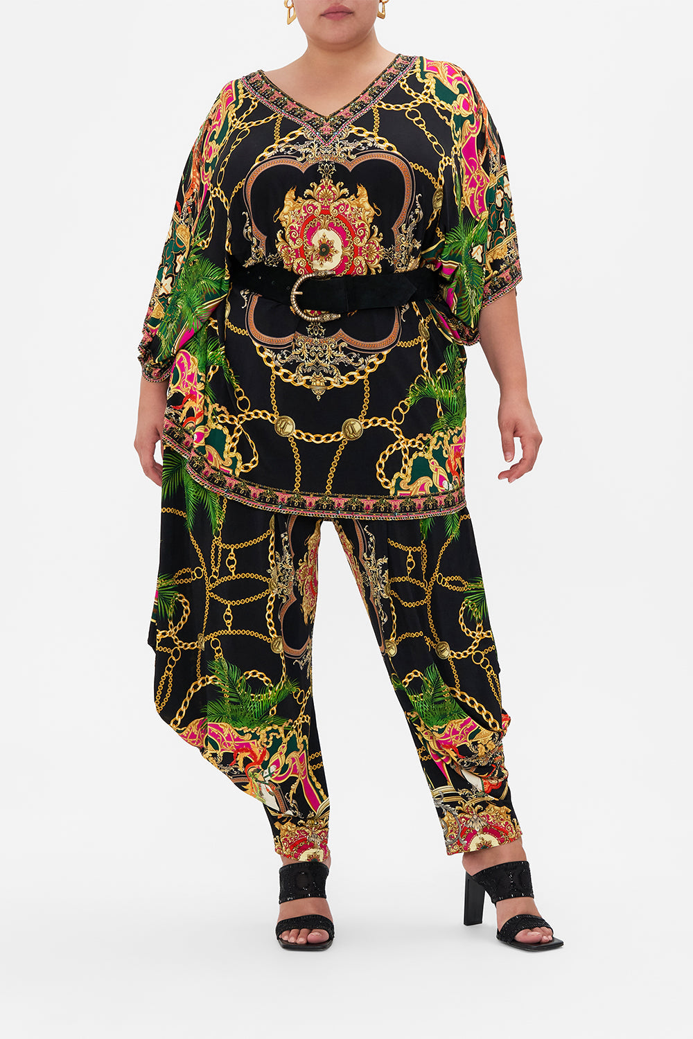 Front view of curvy model wearing CAMILLA plus size bat sleeve tunic dress in Jealousy And Jewels print