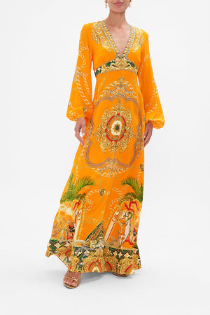 Front view of model wearing CAMILLA orange silk maxi dress in Dancing With The Bulls print