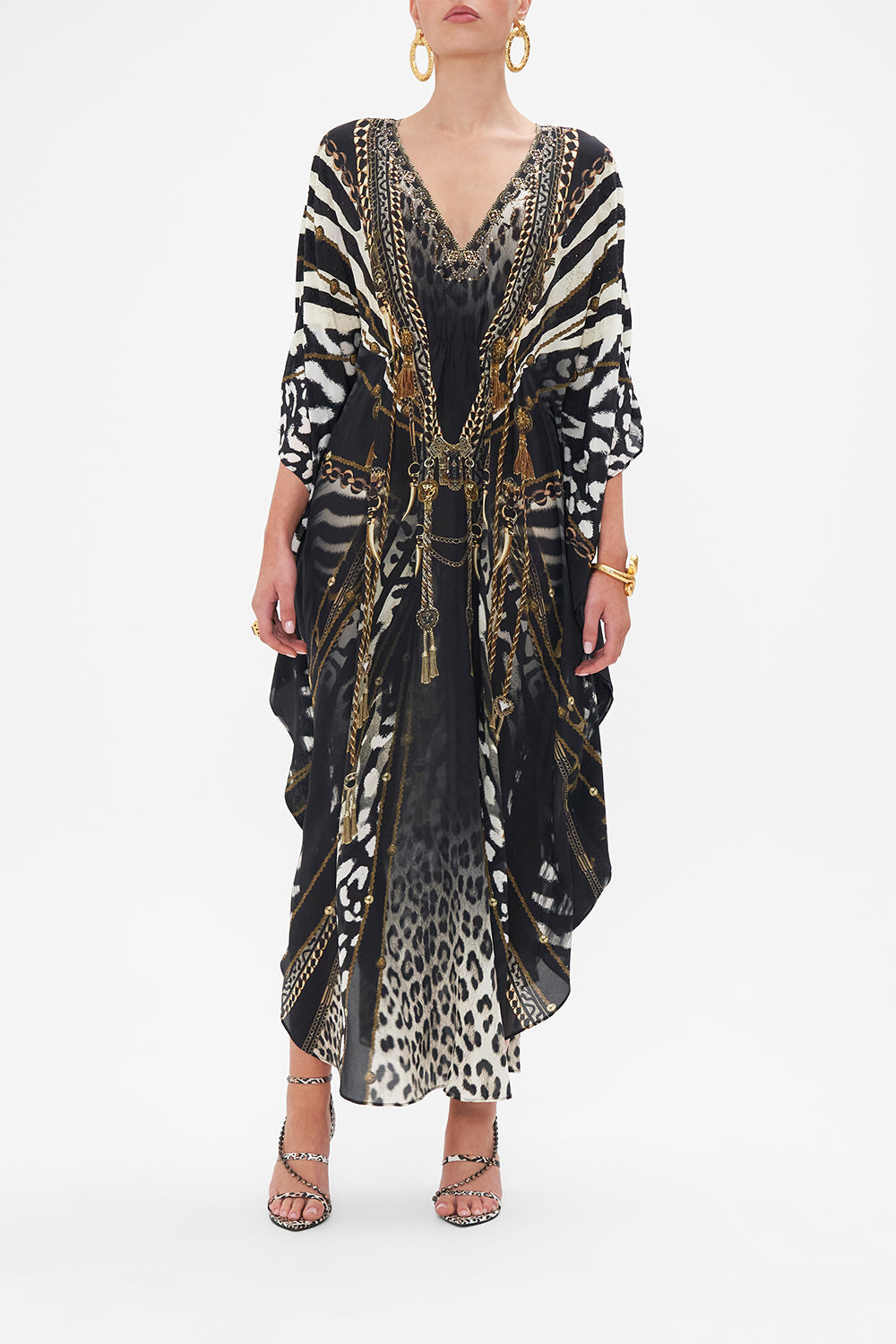 Front view of model wearing CAMILLA black and white animal print kaftan in Untamed Royalty print
