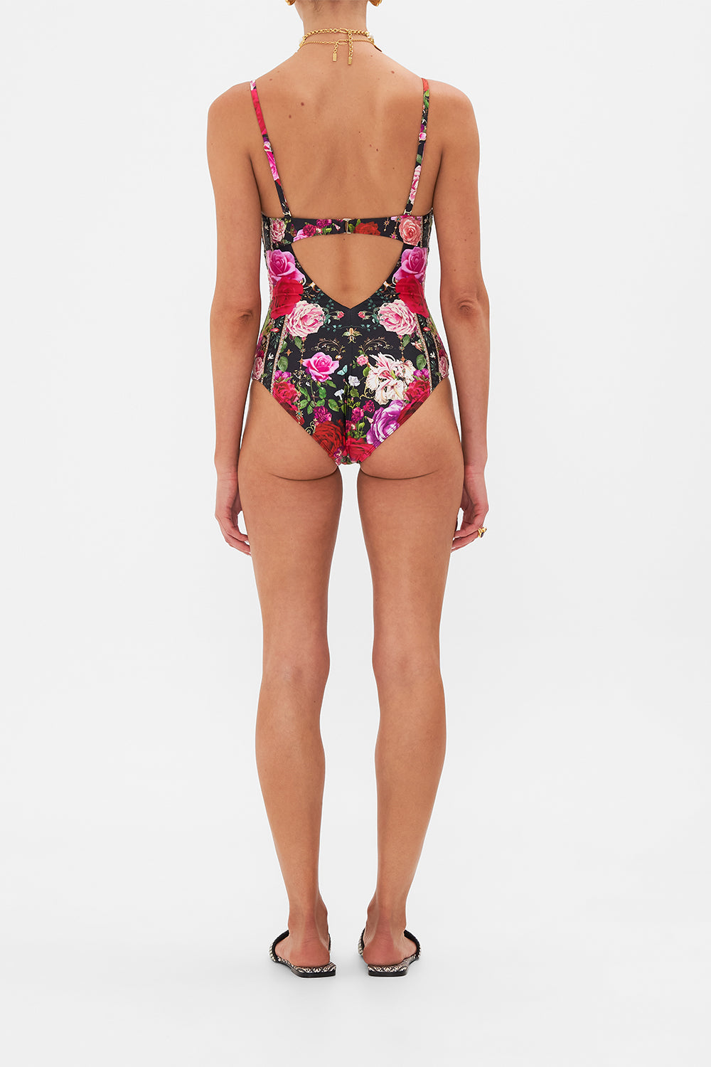 Back view of model wearing CAMILLA underwire one piece swimsuit in Reservation For Love print 