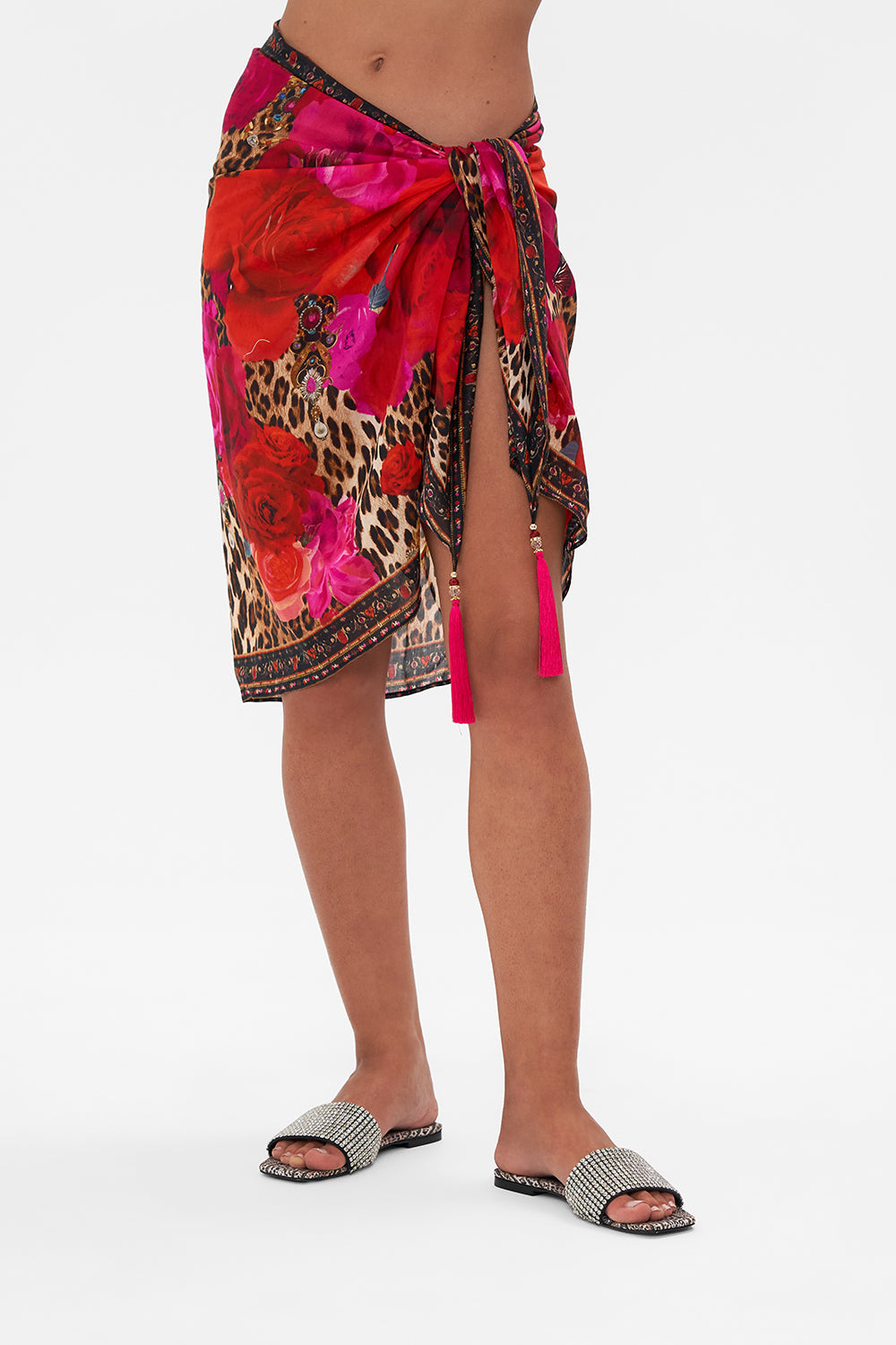 Crop view of model wearing CAMILLA resortwear short sarong in Heart Like Wildflower print