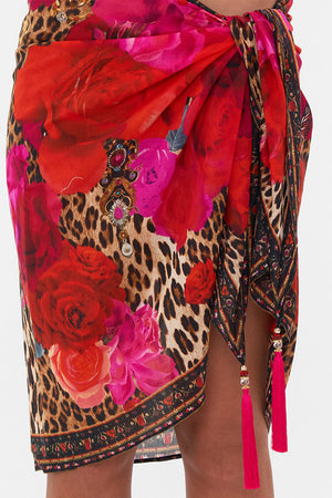 Detail view of model wearing CAMILLA resortwear short sarong in Heart Like Wildflower print