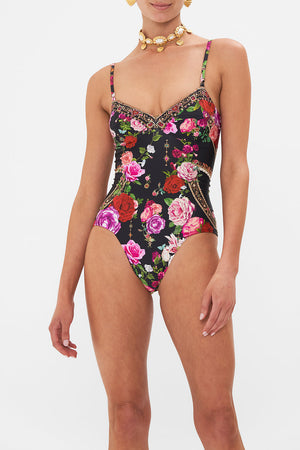 Crop view of model wearing CAMILLA floral one piece swimsuit in Reservation for Love print