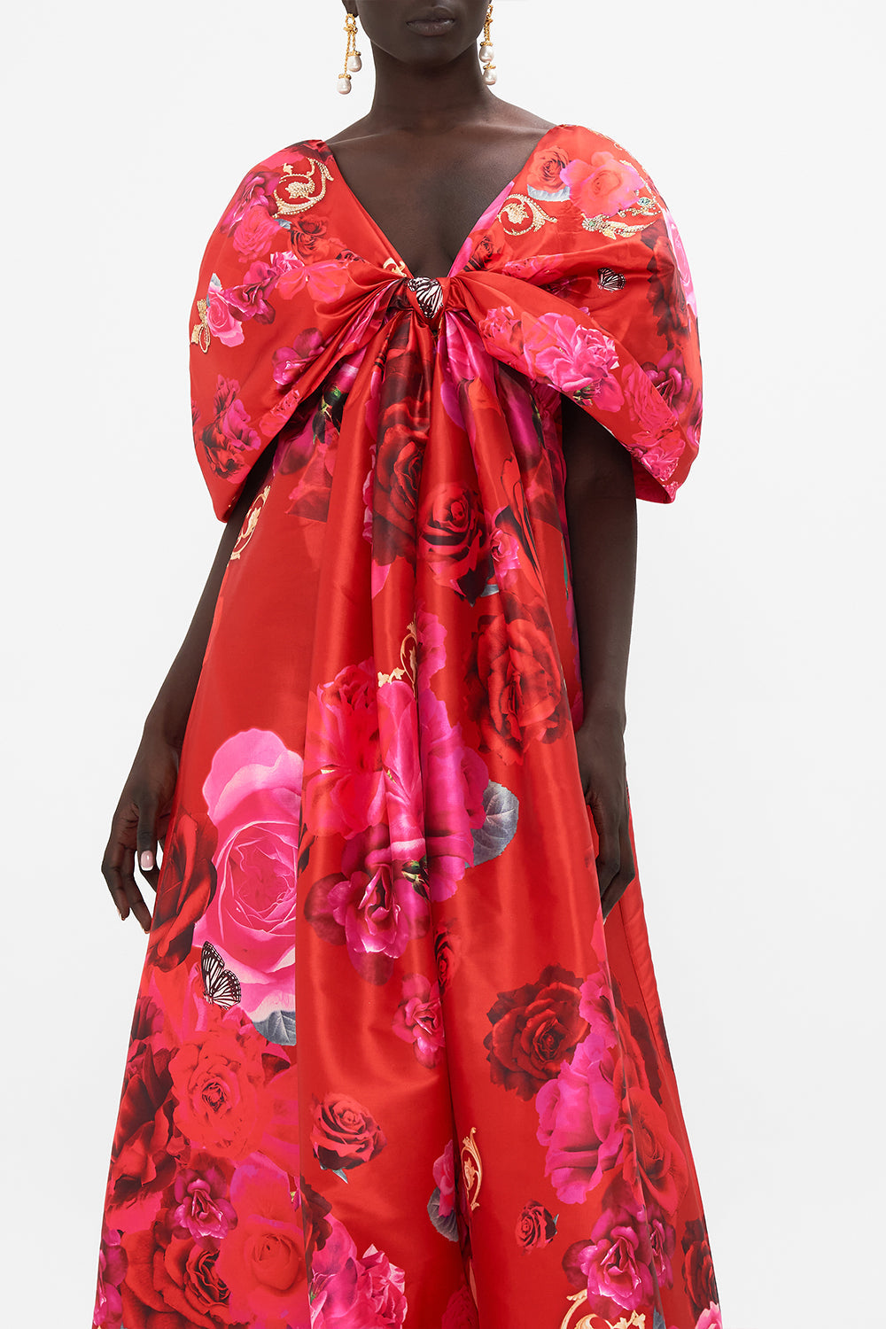 Crop view of model wearing CAMILLA taffeta maxi dress with bow detail in An Italian Rosa print  