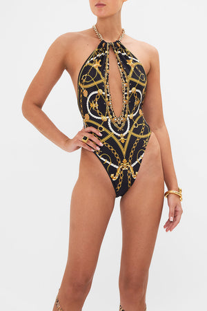 Detail view of model wearing CAMILLA designer one piece in Coast to Coast print