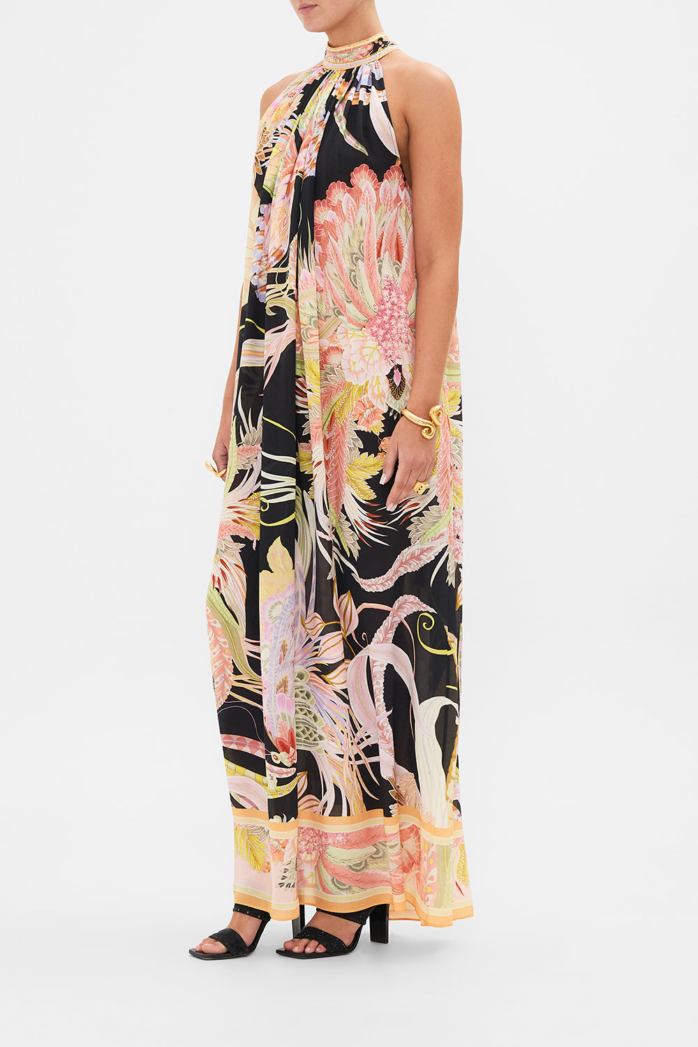 Side view of model wearing CAMILLA silk floral maxi dress in Lady of The Moon print