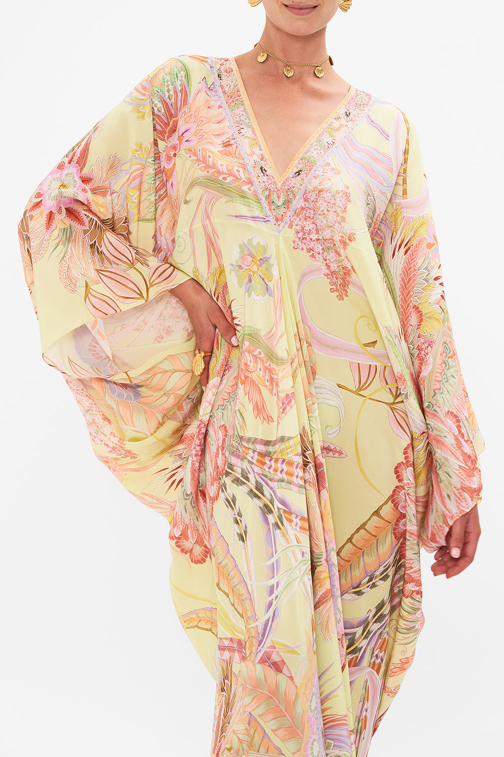 Crop view of model wearing CAMILLA designer silk floral kaftan in Cosmic Tuscan print