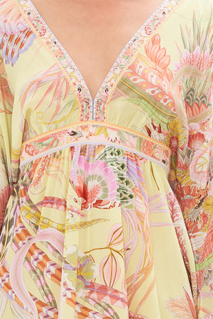 Detail view of model wearing CAMILLA silk kimono mini dress with feathers in Cosmic Tuscan print