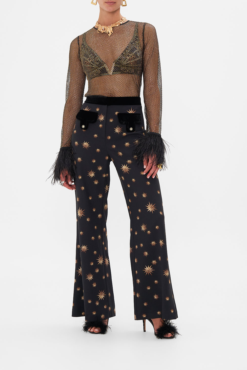 Front view of model wearing CAMILLA designer flared pants in Soul of A Stargazer print