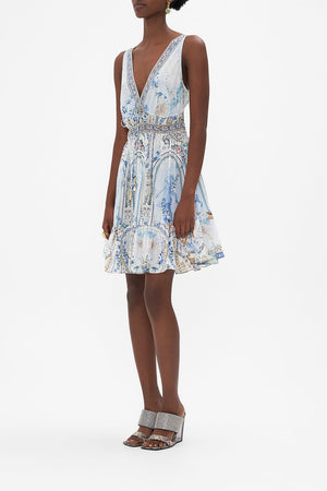 Side view of model wearing CAMILLA silk mini dress in Season of tHe Siren print 