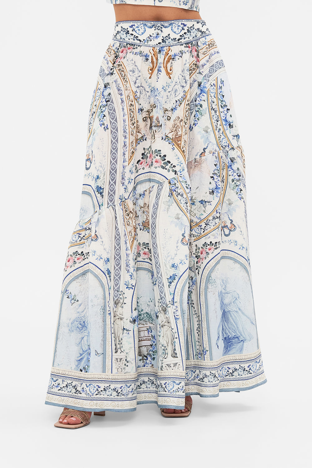 Crop view of model wearing CAMILLA designer skirt in Season Of The Siren print 