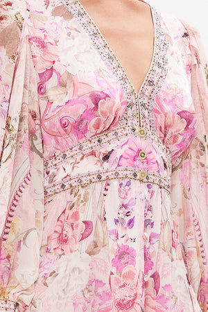 Detail view of model wearing CAMILLA pink silk dress in Fresco Fairytale print