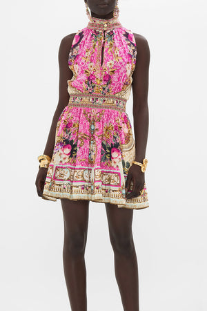 Crop view of model wearing CAMILLA pink silk mini dress in Call Of The Canal print