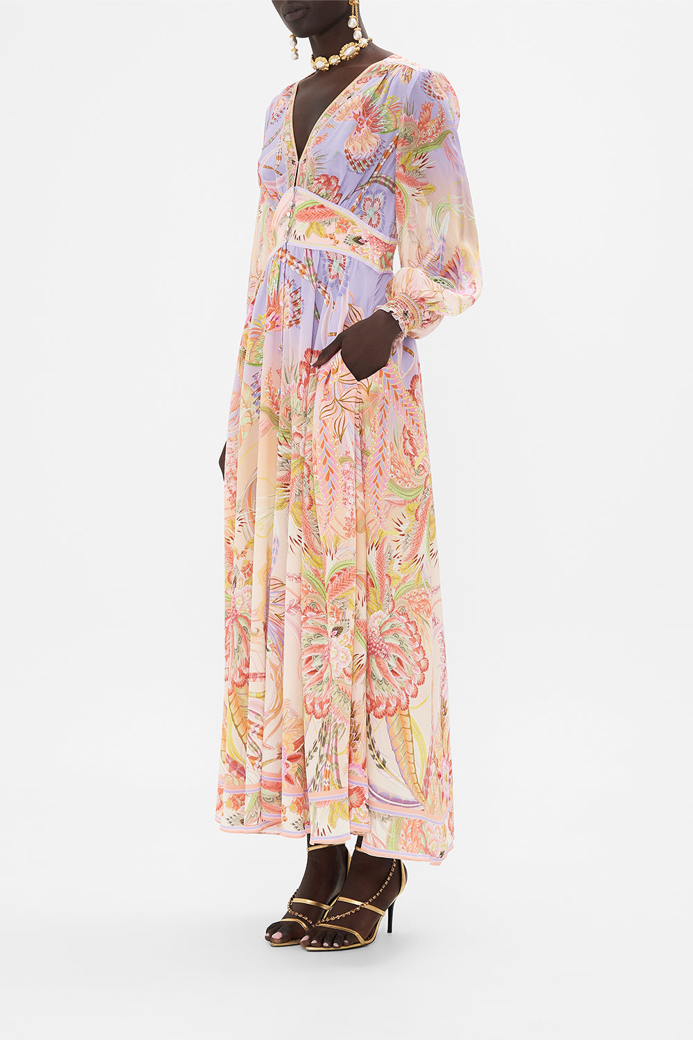 Side view of model wearing CAMILLA designer silk dress in Cosmic Tuscan print 