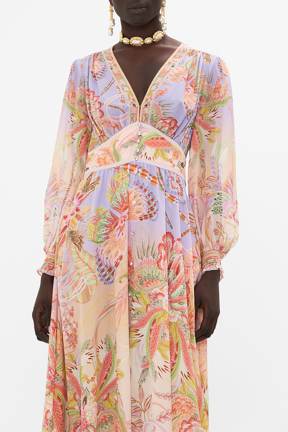 Crop view of model wearing CAMILLA designer silk dress in Cosmic Tuscan print 