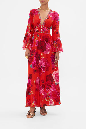 Front view of model wearing designer floral ruffle dress in An Italian Rosa print 