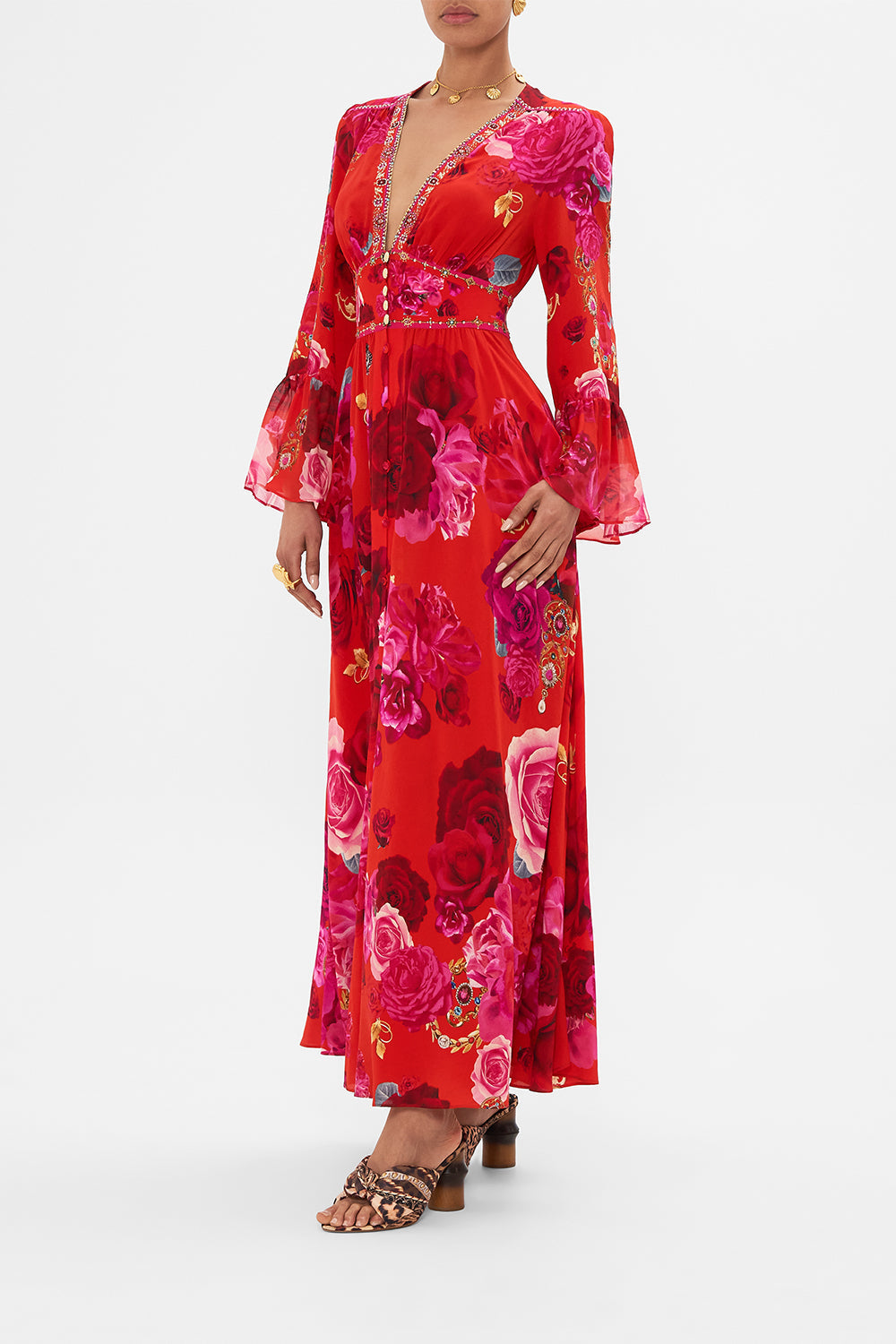 Side view of model wearing designer floral ruffle dress in An Italian Rosa print 