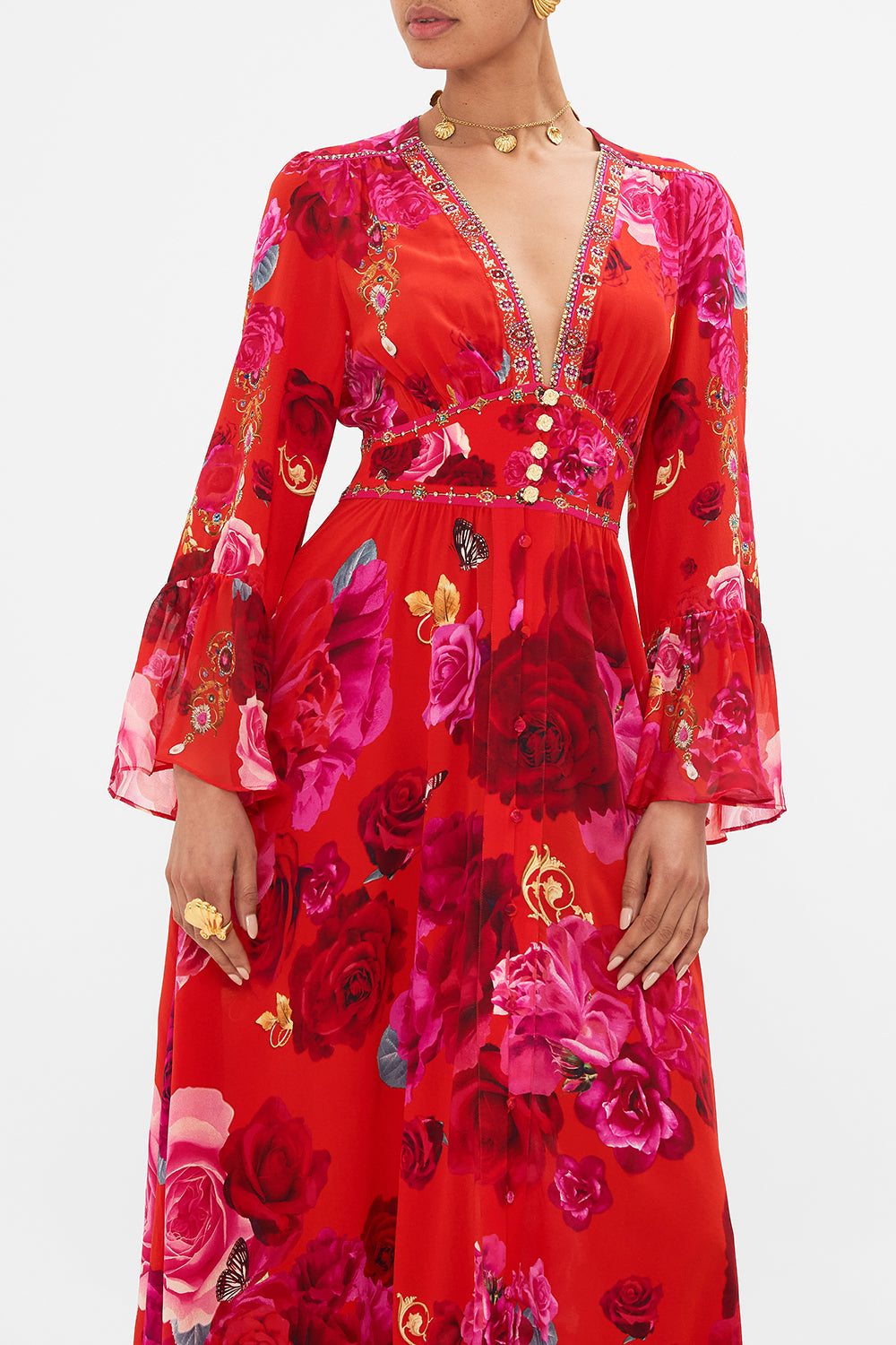 Crop view of model wearing designer floral ruffle dress in An Italian Rosa print 