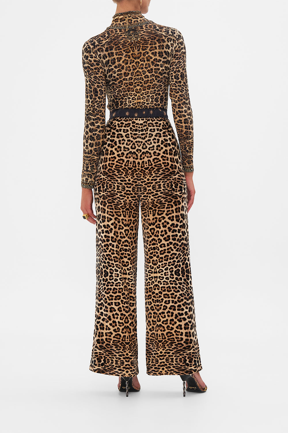 Back view of model wearing CAMILLA silk pants in Soul of A Star Gazer print 