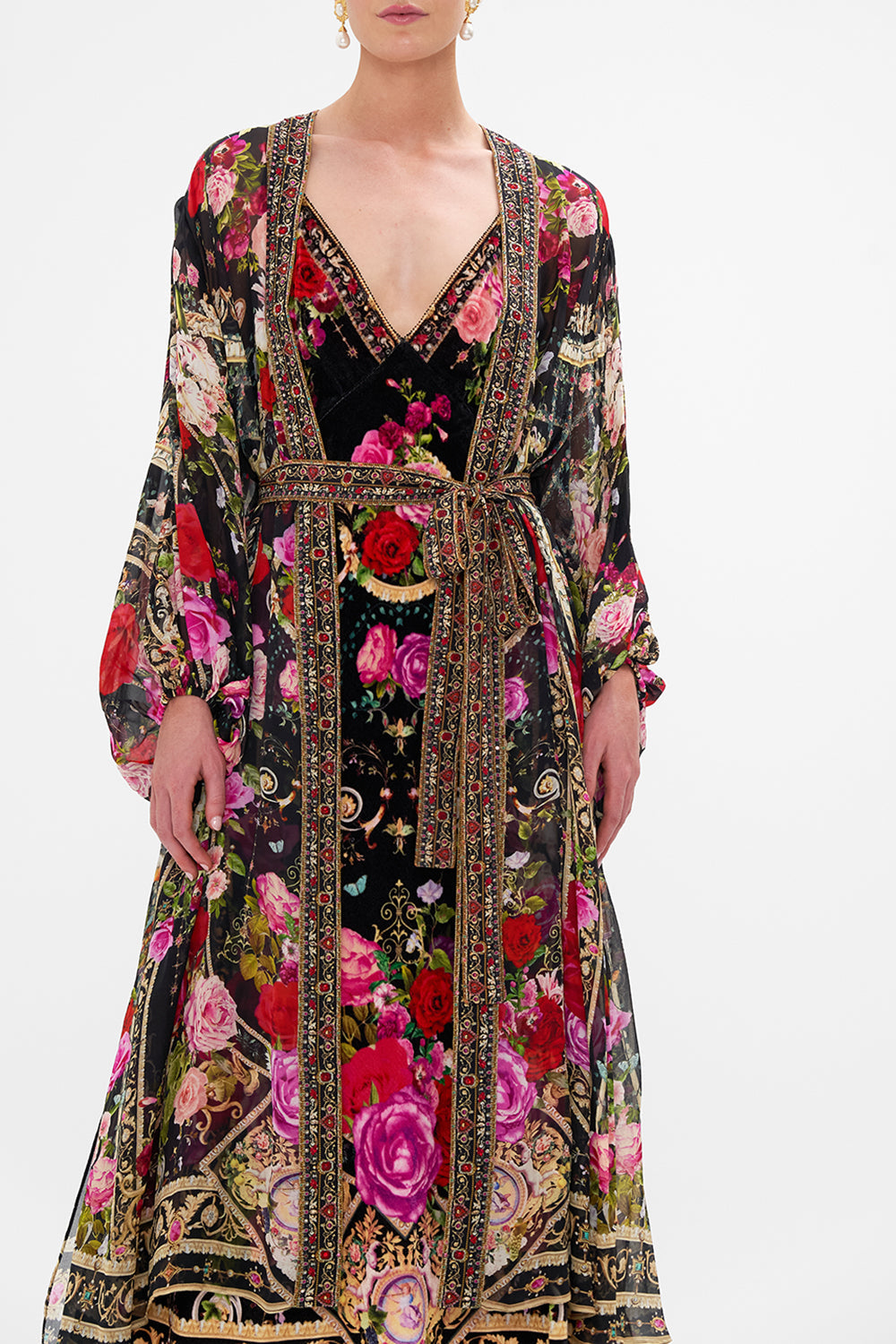 Detail view of model wearing CAMILLA silk kimono layer in Reservation For Love print 