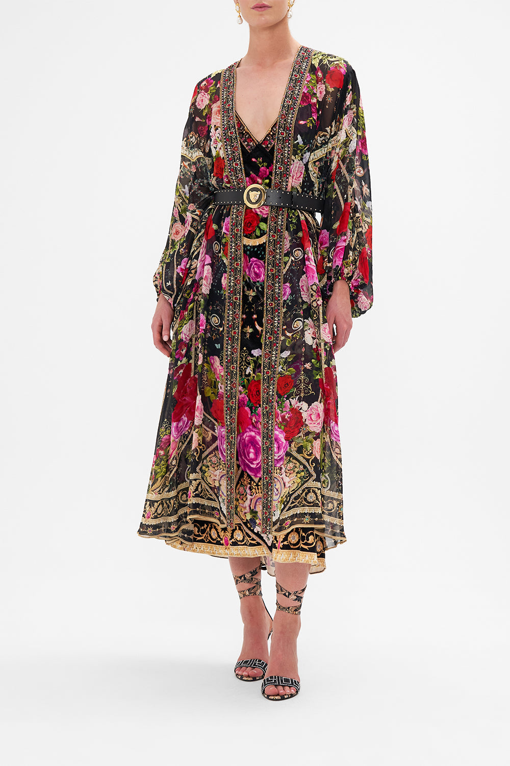 Crop view of model wearing CAMILLA silk kimono layer in Reservation For Love print 