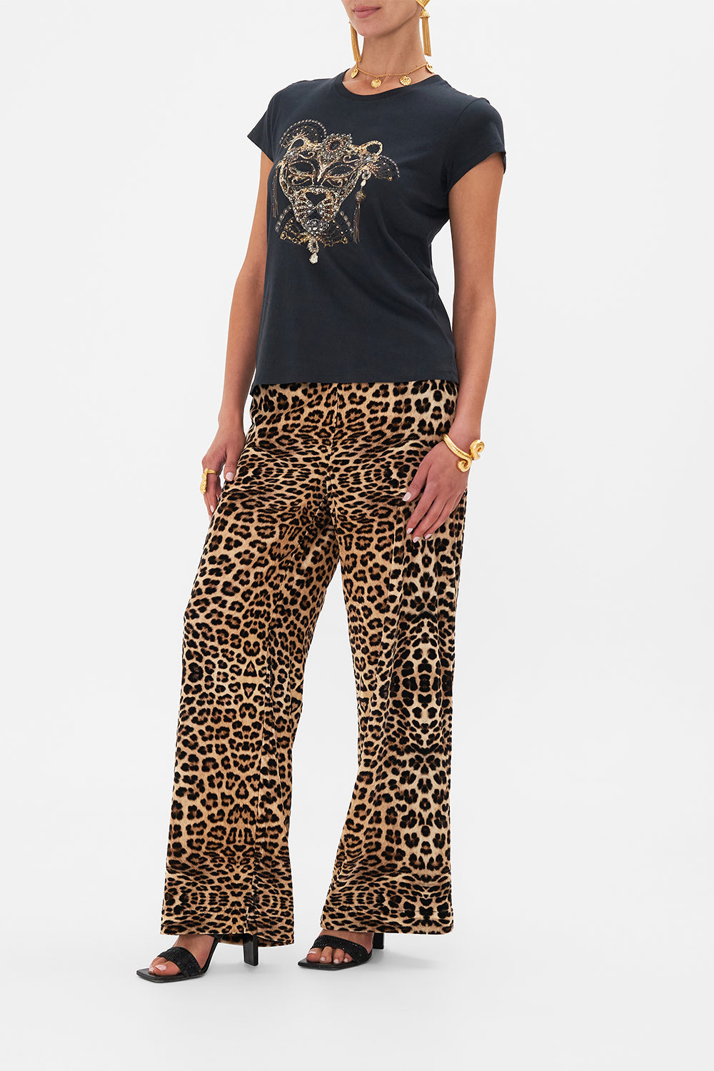 Side view of model wearing CAMILLA luxury t shirt in Masked At Moonlight print