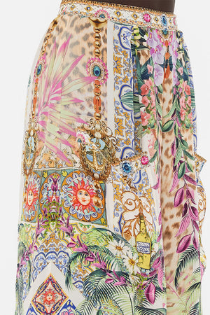 Detail view of model wearing CAMILLA floral silk pants in Flowers Of Neptune print 