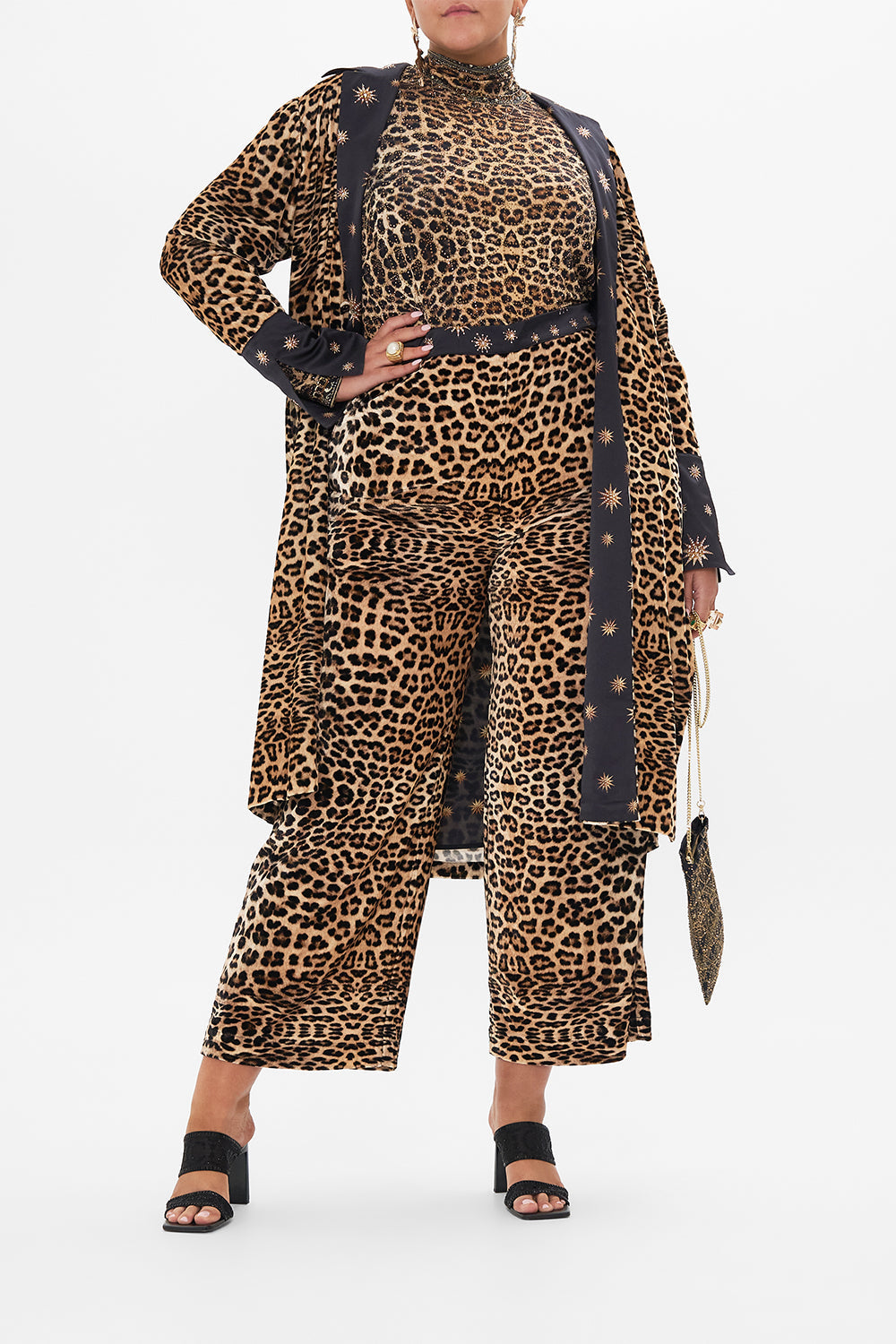 Front view if curvy model wearing CAMILLA  plus size leopard print turtleneck top in Soul of A Star Gazer print