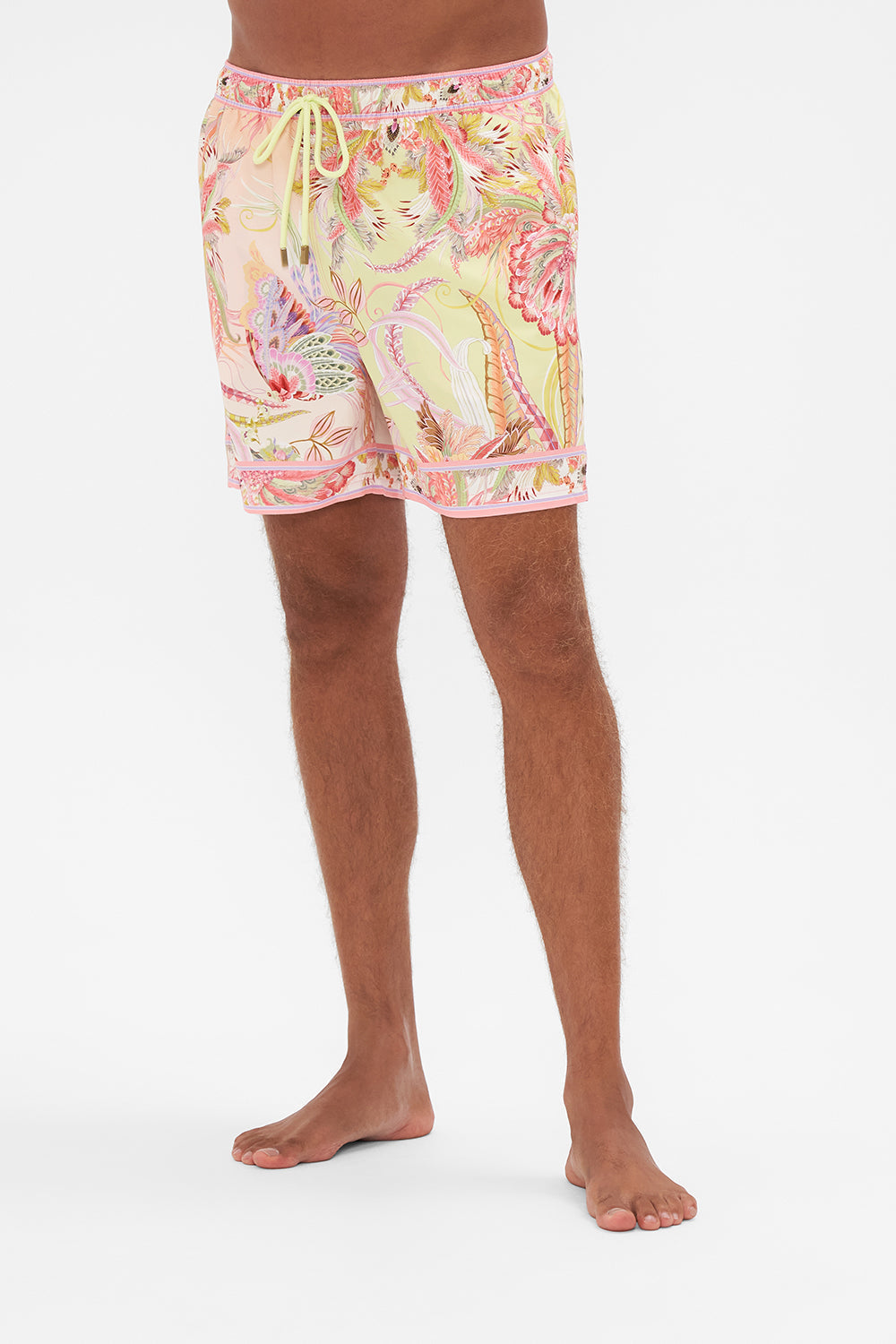 Crop view of model wearing Hotel Franks by CAMILLA mens luxury boardshorts in Cosmic Tuscan print