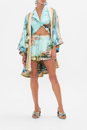 Detail view of model wearing CAMILLA silk robe in from Sorrento With Love print