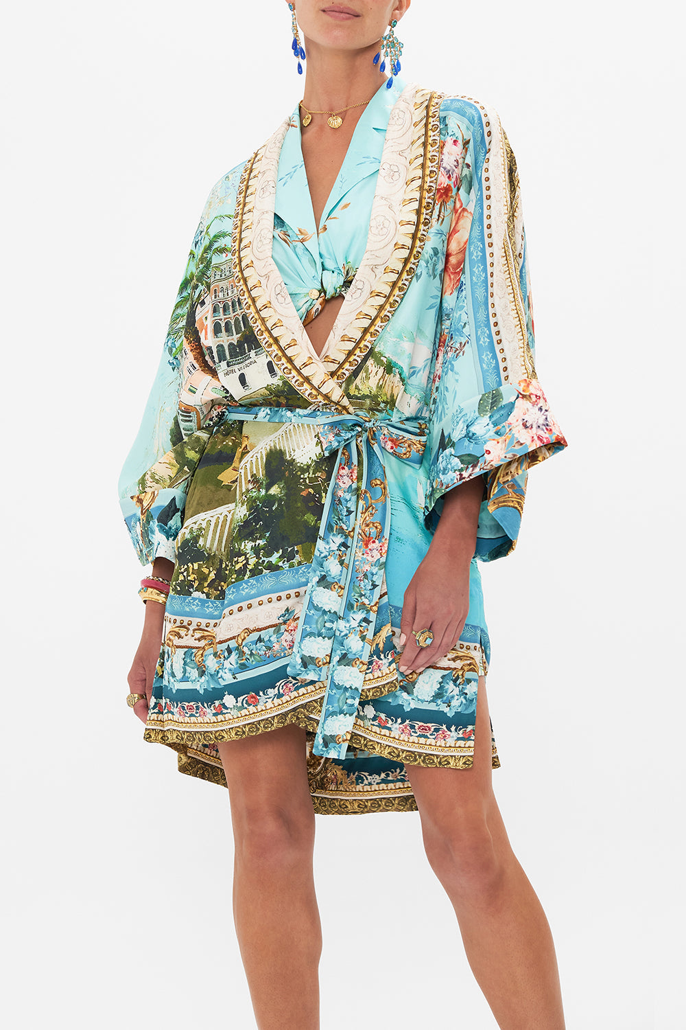Crop view of model wearing CAMILLA silk robe in from Sorrento With Love print