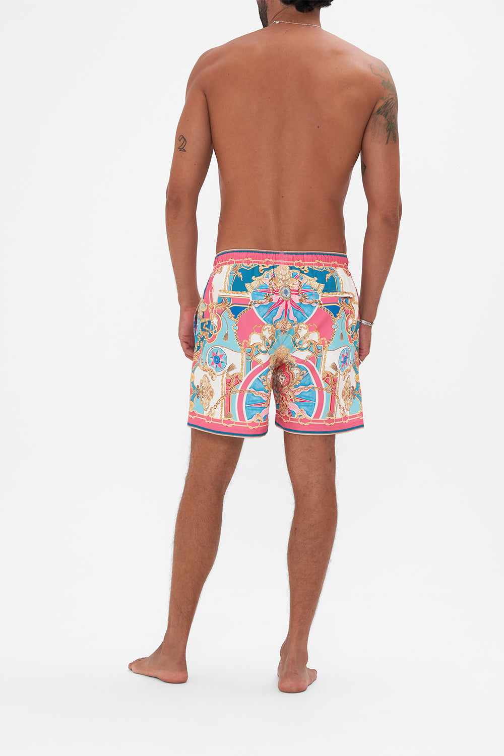 Back view of model wearing Hotel Franks by CAMILLA designer boardshorts in Sail Away With Me print 