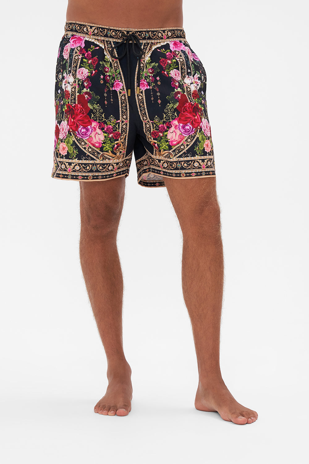 Crop view of model wearing Hotel Franks by CAMILLA mens boardshorts in Reservation For Love print 
