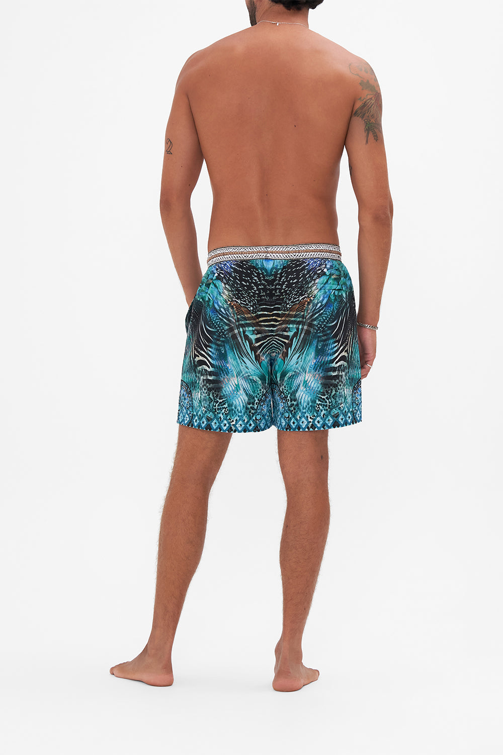 Back view of model wearing Hotel Franks By CAMILLA luxury mens boardshorts in Azure Allure