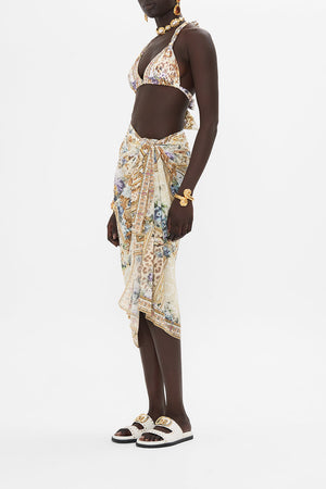 Side view of model wearing CAMILLA resortwear sarong in Palazzo Playdate print