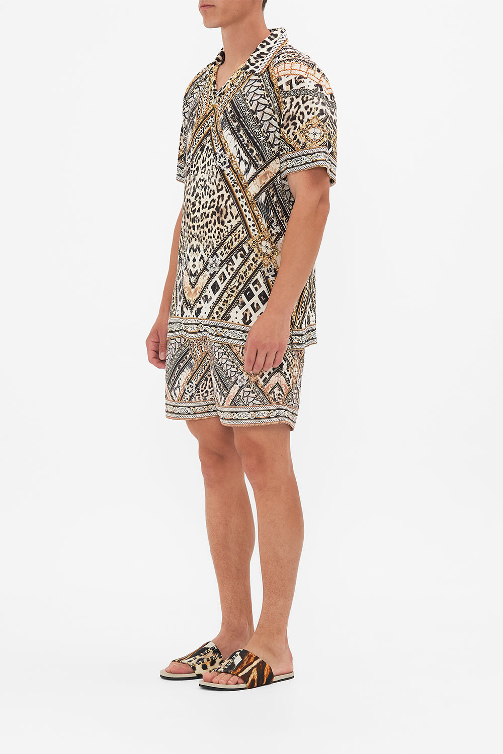 Side view of model wearing Hotel Franks By CAMILLA  mens short sleeve camp collared shirt in Mosaic Muse print 