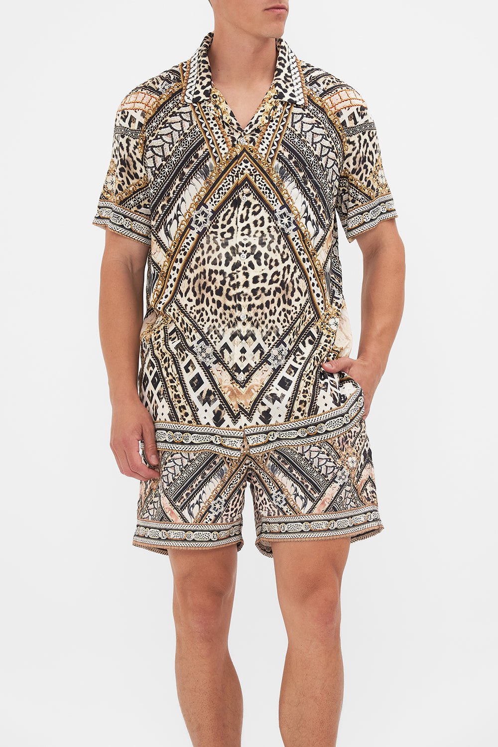 Crop view of model wearing Hotel Franks By CAMILLA mens short sleeve camp collared shirt in Mosaic Muse print 