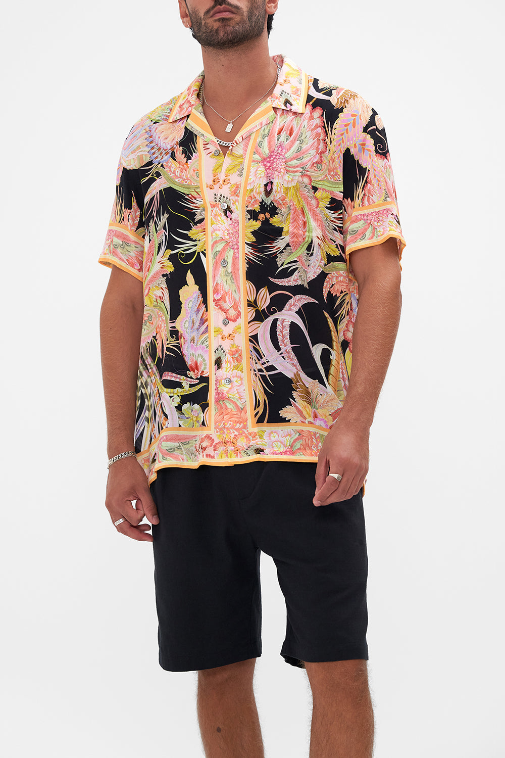 Crop view of model wearing Hotel Franks by CAMILLA mens camp collared shirt in Lady of the Moon print