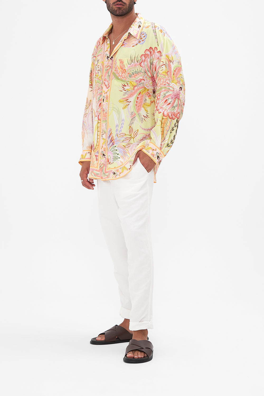 Side view of model wearing Hotel Franks by CAMILLA mens silk shirt in Cosmic Tuscan print