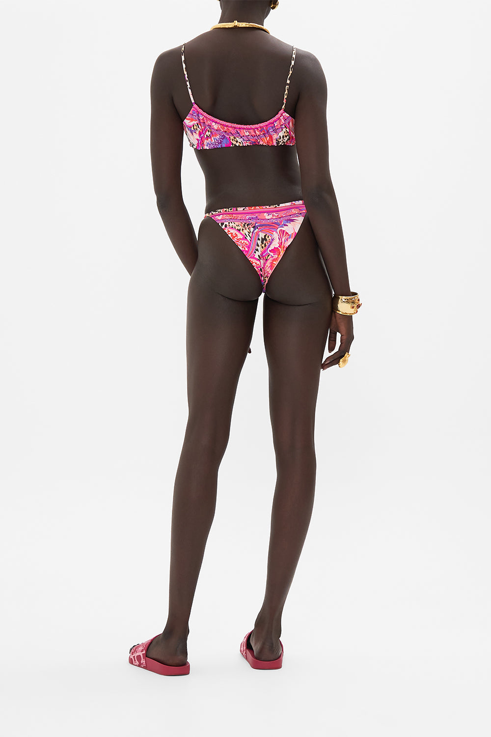 Back view of model wearing CAMILLA resortwear bikini bottom in Viola Vintage print 