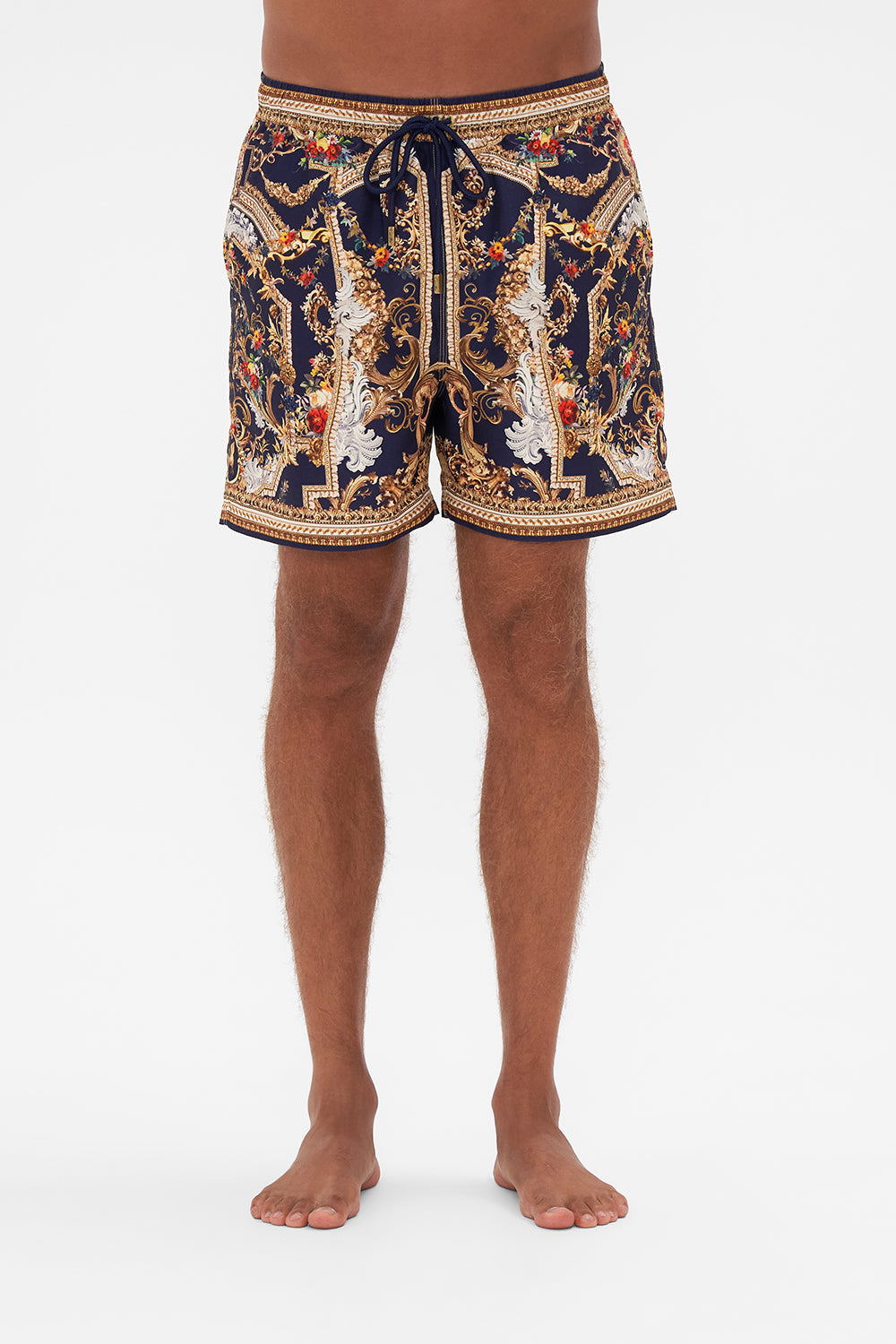 Crop view of model wearing Hotel Franks by CAMILLA mens boardshort in Venice Vignette print