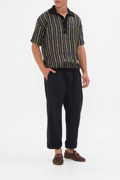 Front view of model wearing Hotel Franks by CAMILLA mens shirt sleeve polo shirt in Coast to Coast print 