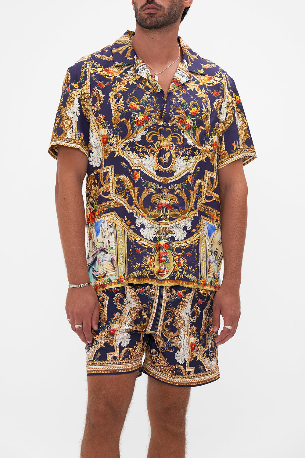 Crop view of model wearing Hotel Franks By CAMILLA mens short sleeve camp collared shirt in  Venice Vignette print 