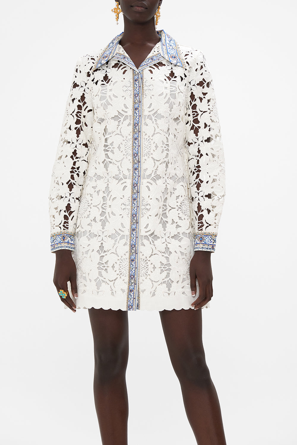 Crop view of model wearing CAMILLA silk tunic dress in Season Of The Siren print